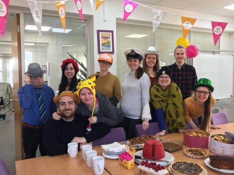 staff wearing funny hats