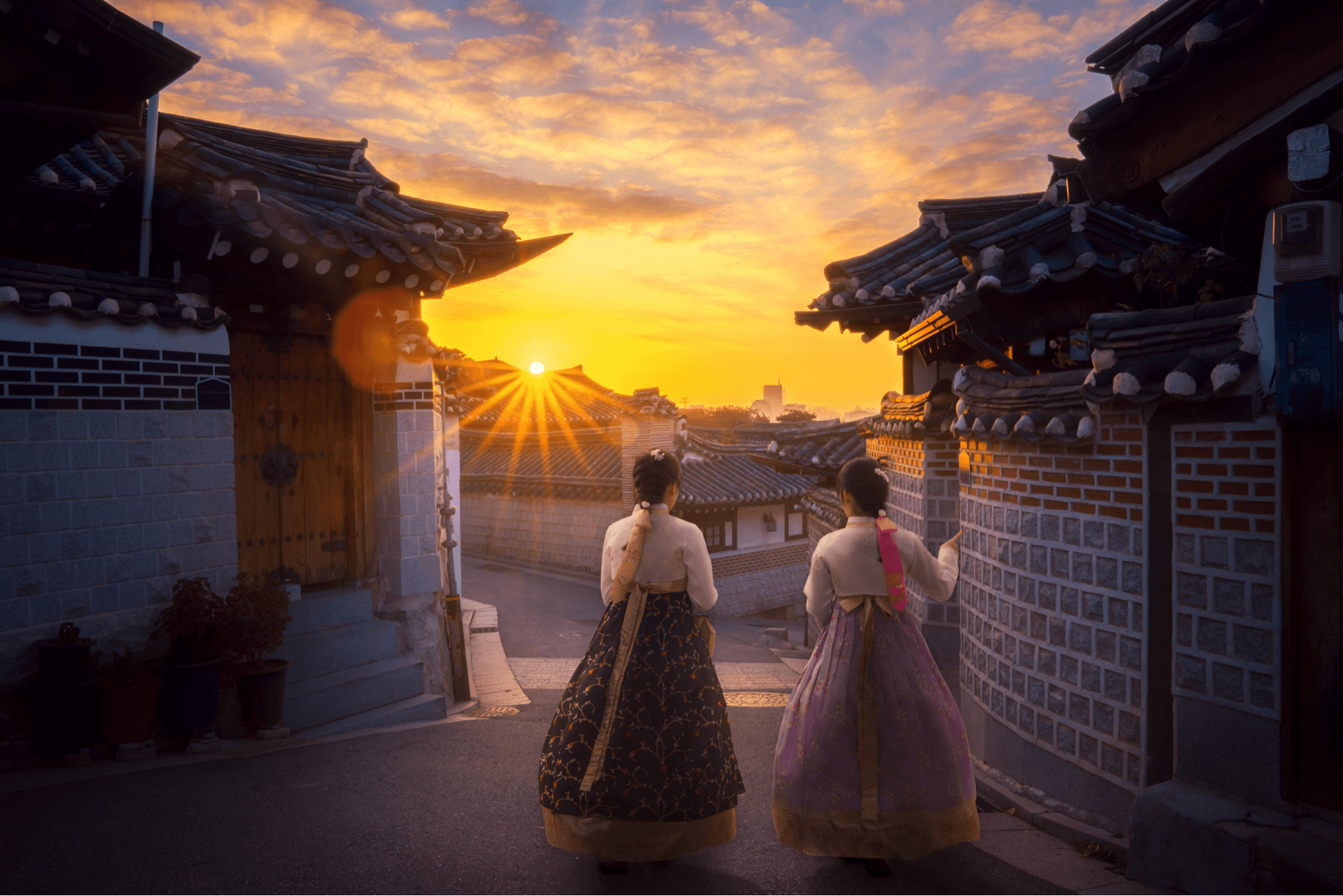 Asian ladies in Hanbok dress walk together in Korea