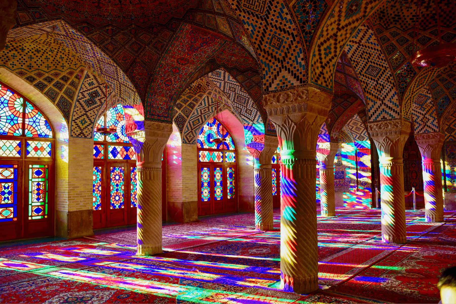 room with amazing carpets and stained glass windows