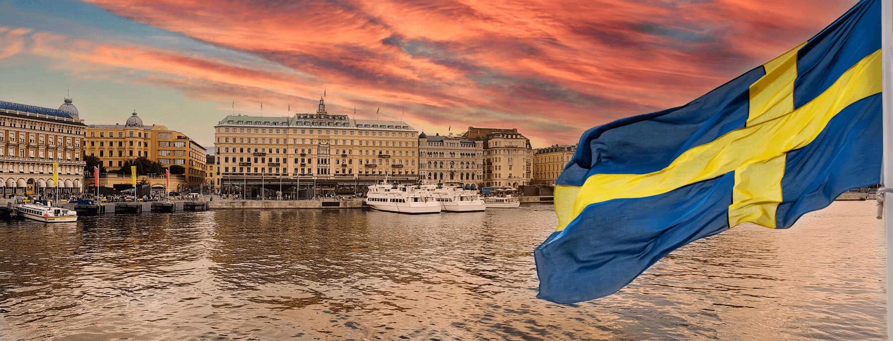 Swedish flag in front of harbour